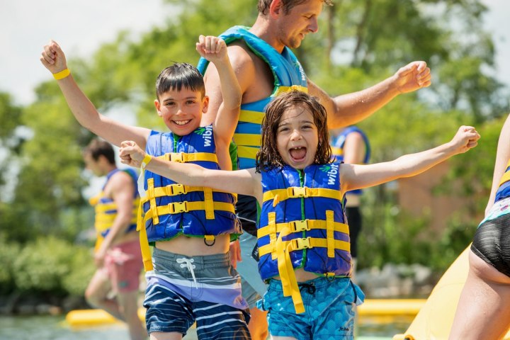 a young boy playing with a frisbee