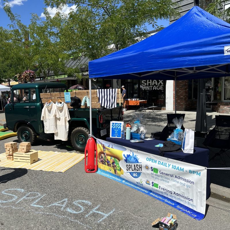 a group of people standing in a parking lot